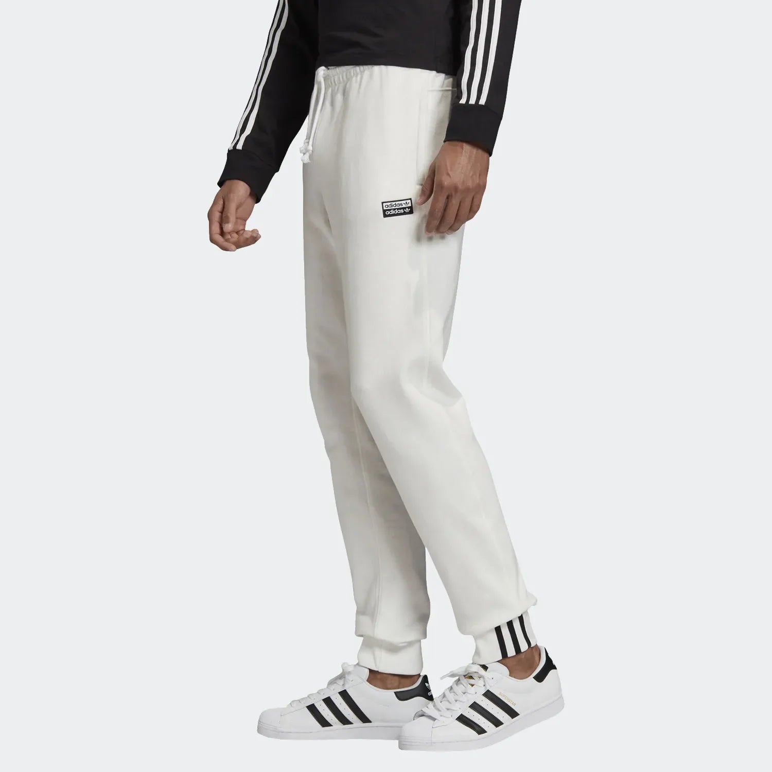 Highlights the tapered leg and the signature stacked logo badge.
