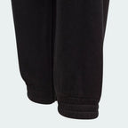 Close-up of black pants on a light gray background
