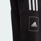 Black Adidas hoodie with logo and three stripes on a light gray background