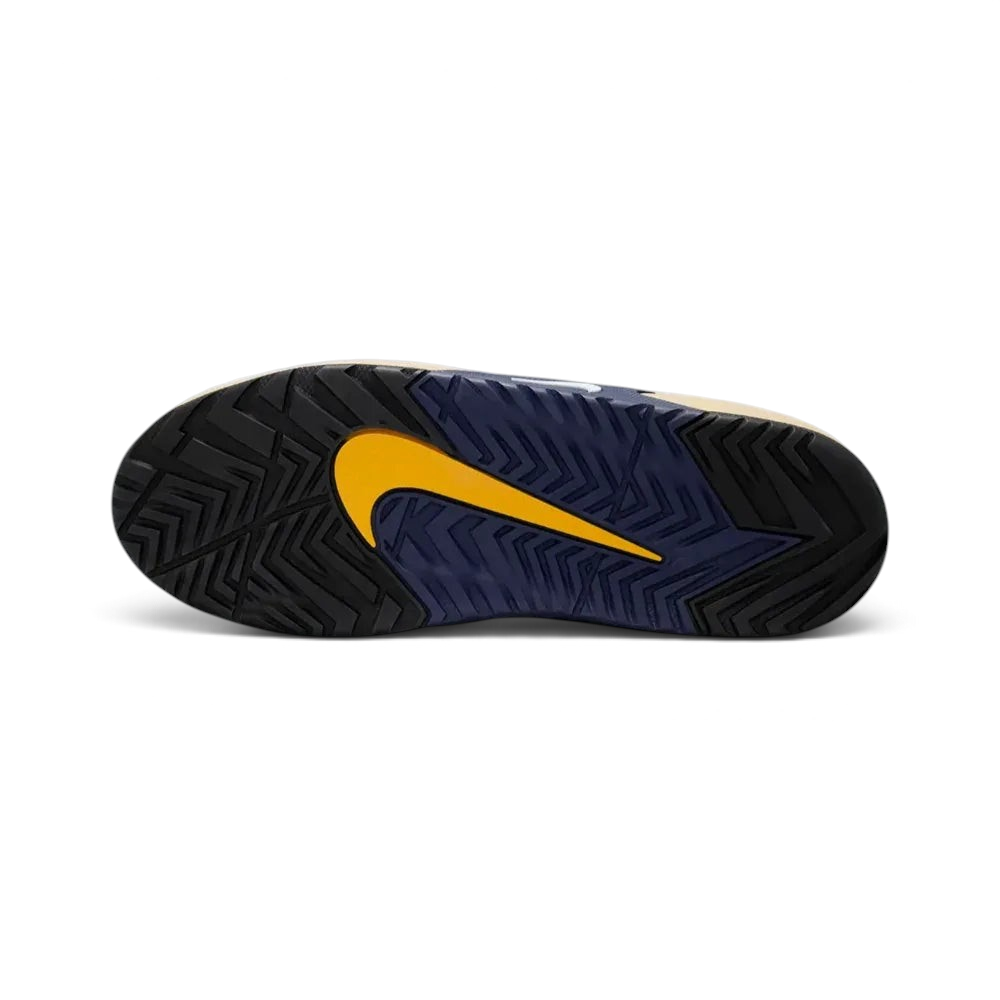 View of the gum rubber outsole, showcasing the specialized breaking traction pattern designed for both grip and smooth sliding.