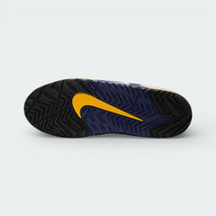 View of the gum rubber outsole, showcasing the specialized breaking traction pattern designed for both grip and smooth sliding.