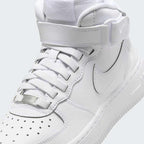 Close-up of Nike Air Force 1 Mid EasyOn Juniors White FN1193-111 laces, leather texture, and branding