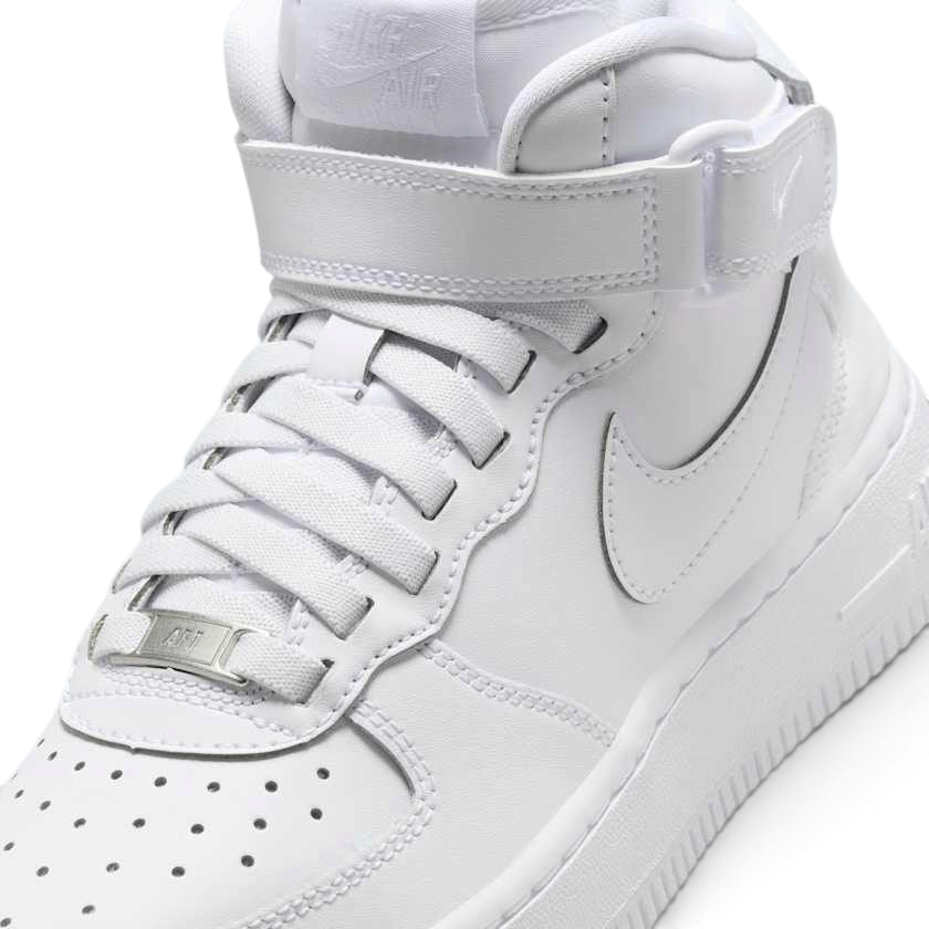 Close-up of Nike Air Force 1 Mid EasyOn Juniors White FN1193-111 laces, leather texture, and branding