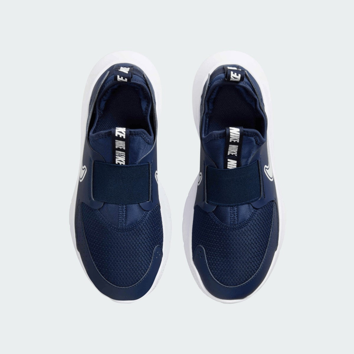 Top-down view of a pair of Nike Flex Runner 3 Juniors' trainers in navy, highlighting their streamlined silhouette and laceless construction.