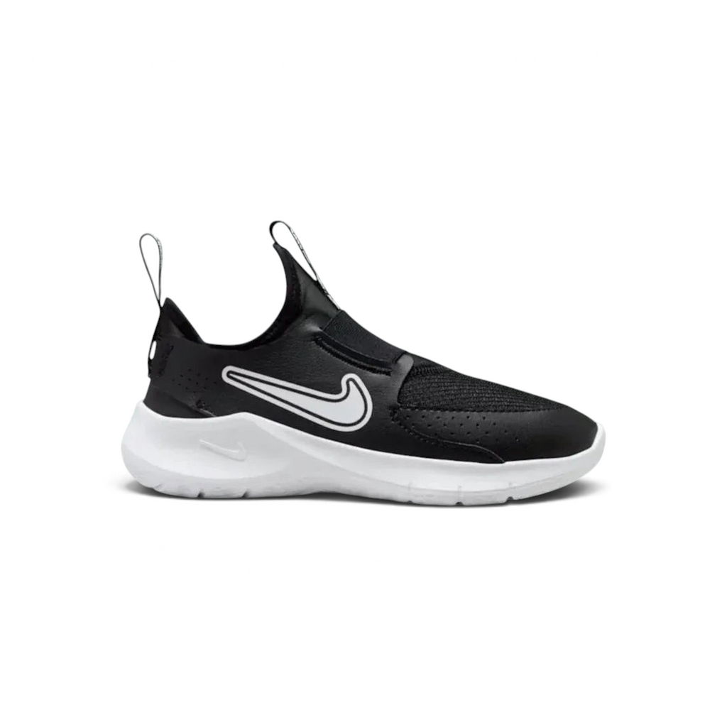 Nike Flex Runner infants slip-on trainers in black and white, side profile showing the stretchy mesh upper and thick white foam sole.