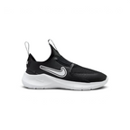 Nike Flex Runner infants slip-on trainers in black and white, side profile showing the stretchy mesh upper and thick white foam sole.