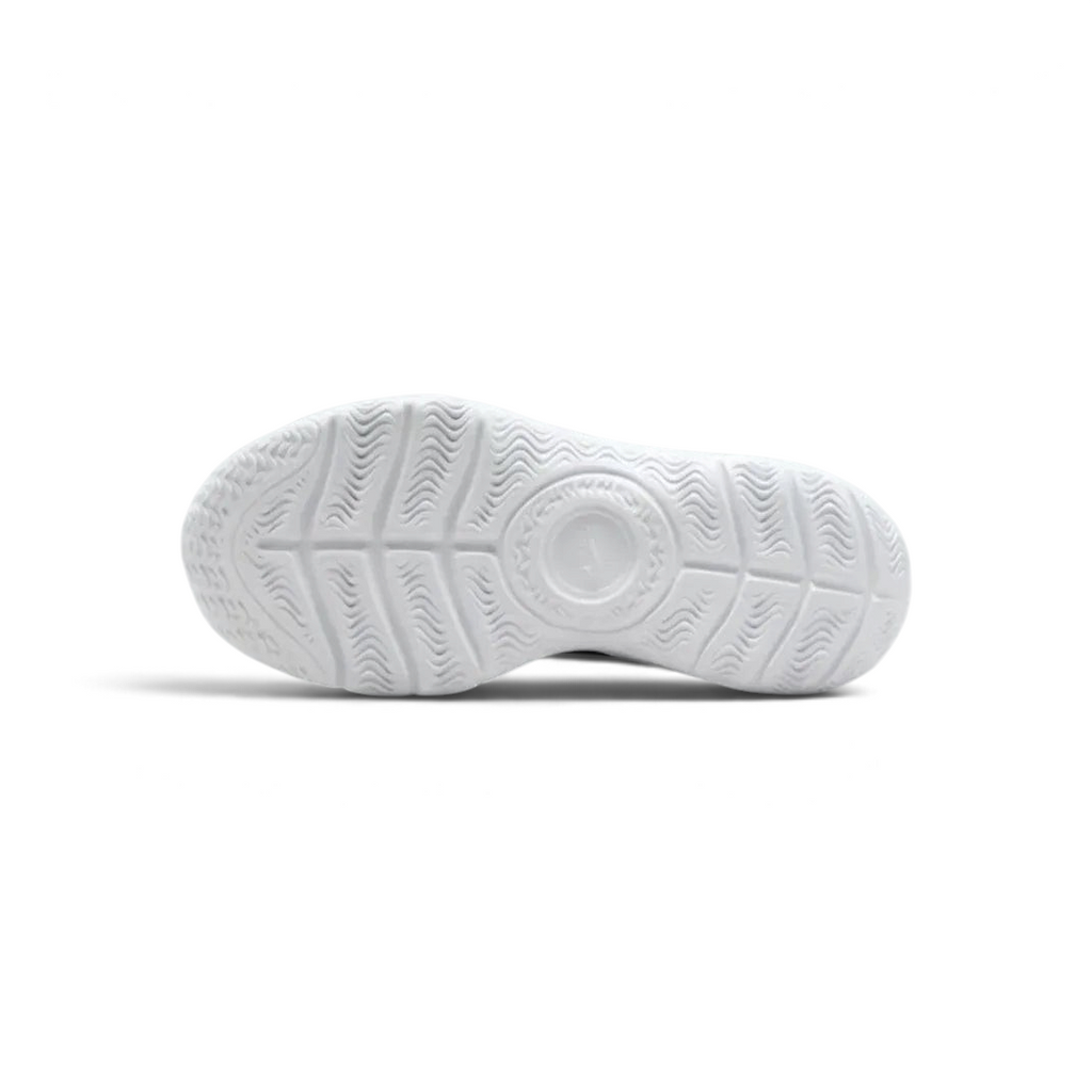 View of the white foam outsole, showing the deep flex grooves designed for natural movement.
