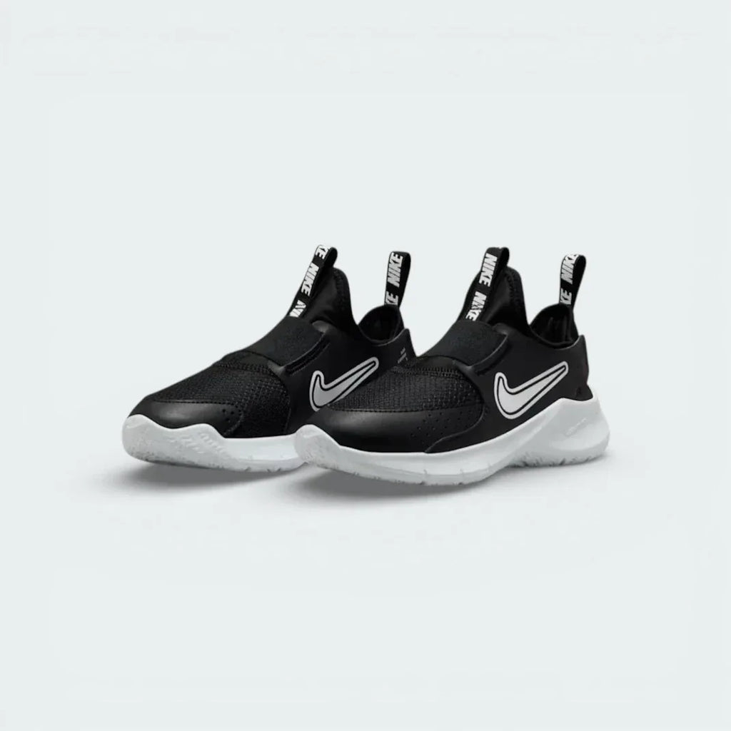 Angled shot of both Nike Flex Runner trainers, showcasing the slip-on silhouette and sleek monochrome design.