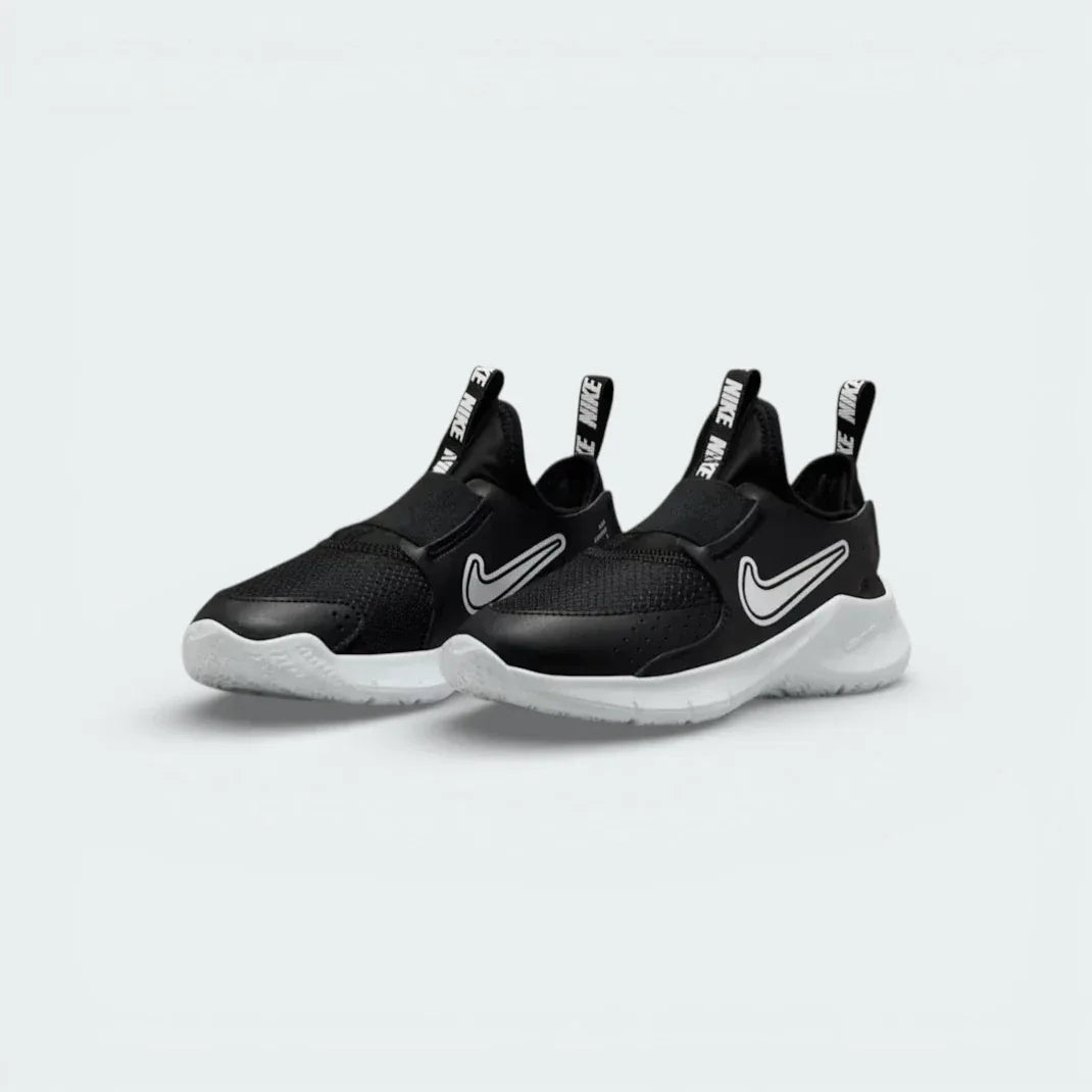 Angled shot of both Nike Flex Runner trainers, showcasing the slip-on silhouette and sleek monochrome design.