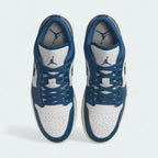 Top-down view of a pair of Air Jordan 1 Low Special Edition Men's trainers in white, highlighting their iconic silhouette and lace-up closure.