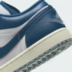 Detailed zoom on the outsole and midsole of the Air Jordan 1 Low Special Edition Men's white trainers, highlighting the cushioned midsole and durable rubber outsole.