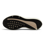 View of the rubber outsole, showcasing the updated traction pattern designed for reliable grip and smooth transitions on the road.