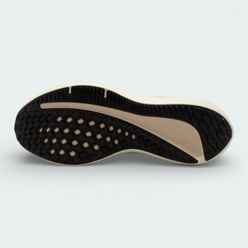 View of the rubber outsole, showcasing the updated traction pattern designed for reliable grip and smooth transitions on the road.