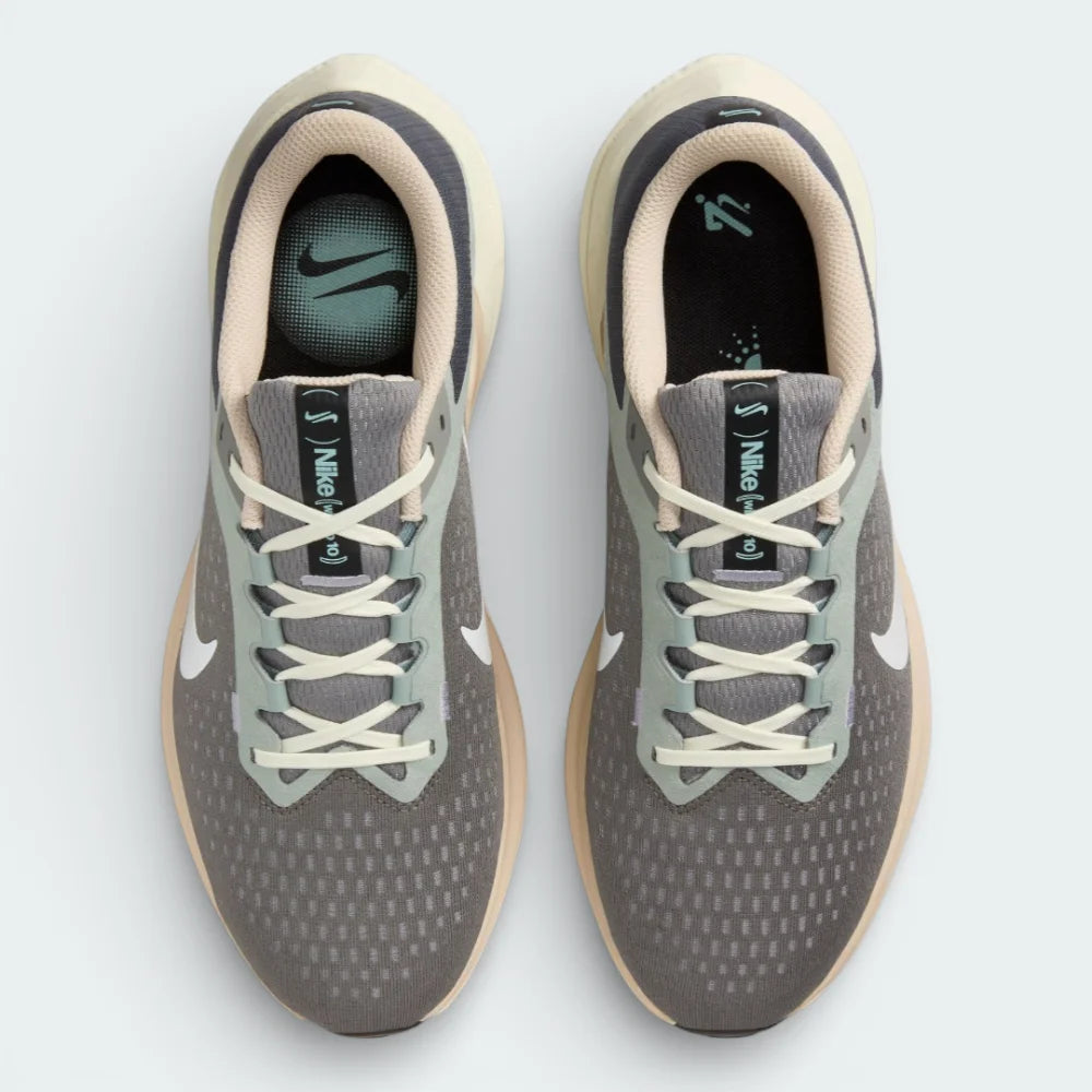 Top-down view of the grey and pewter trainers, highlighting the sleek lacing system and the fine texture of the engineered mesh toe box.