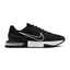 Highlights the high-velocity sweep of the crisp White Nike Swoosh, showing the professional, texturized weave of the Black upper mesh, the sticky rubber wrapping up the side, and the clear window of the visible performance Max Air unit in the heel.