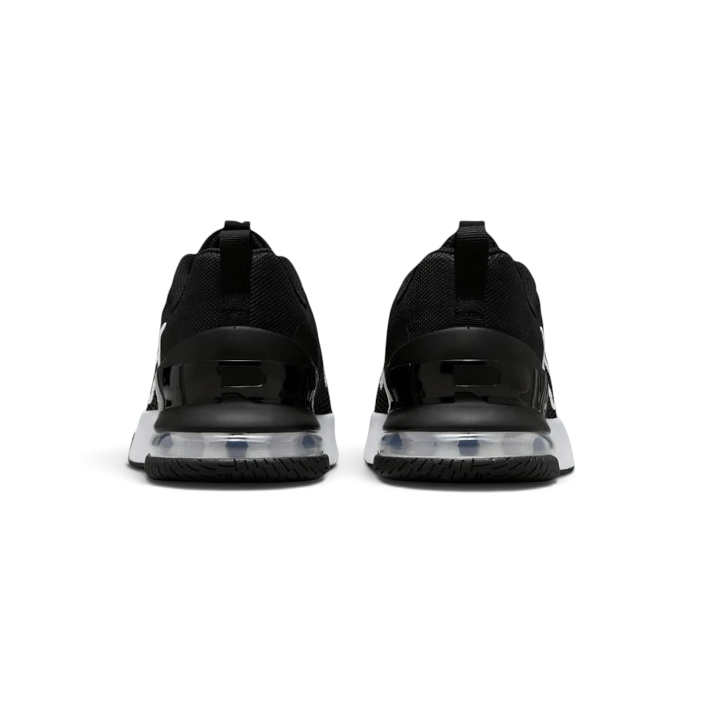 Focuses on the contoured shape of the robust rear heel structure, highlighting the wide, flared footprint engineered to distribute heavy workout loads evenly.