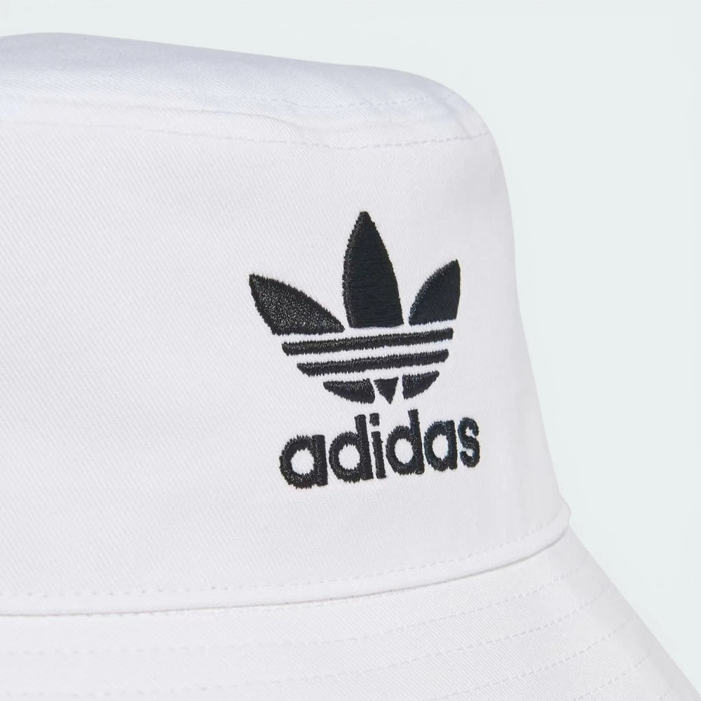 Zoom looking at the Trefoil embroidery, showcasing the precision of the high-density black stitching on the white base.