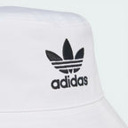 Zoom looking at the Trefoil embroidery, showcasing the precision of the high-density black stitching on the white base.