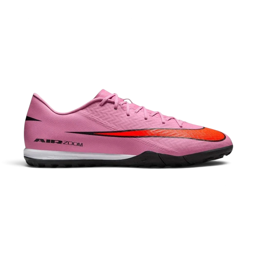 Side profile of the Magic Flamingo pink Nike Mercurial Vapor 16 Academy, showing the sleek NIKESKIN upper and the bold Total Crimson accents.