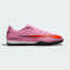Side profile of the Magic Flamingo pink Nike Mercurial Vapor 16 Academy, showing the sleek NIKESKIN upper and the bold Total Crimson accents.