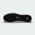 View of the lug rubber outsole, showcasing the aggressive traction pattern designed for stability on turf surfaces.