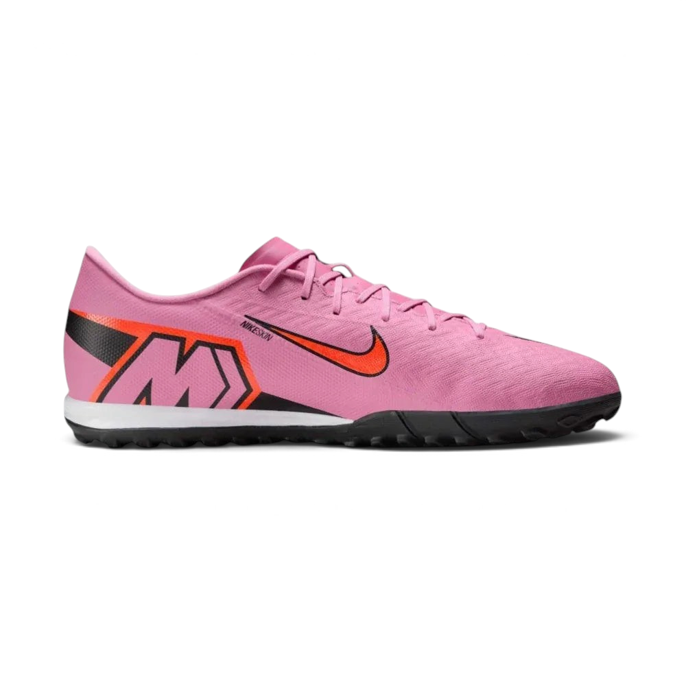 Side profile of the Magic Flamingo pink Nike Mercurial Vapor 16 Academy, showing the sleek NIKESKIN upper and the bold Total Crimson accents.
