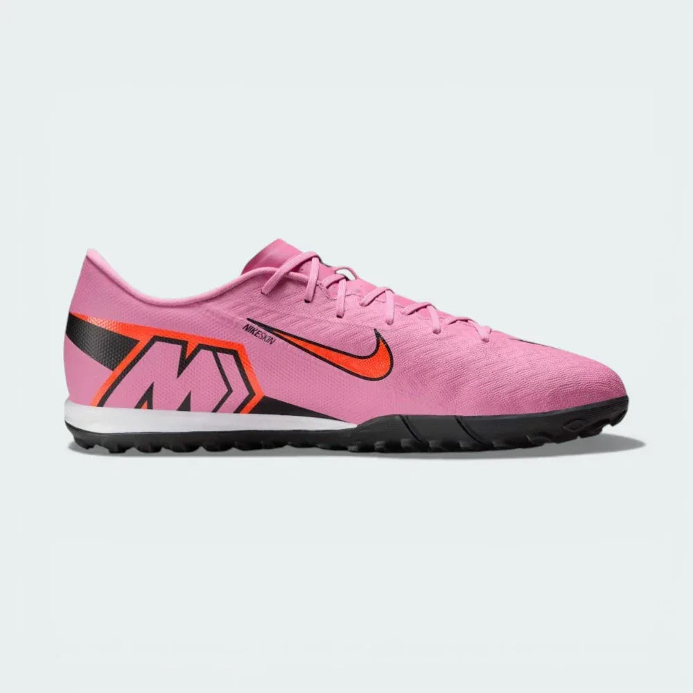 Side profile of the Magic Flamingo pink Nike Mercurial Vapor 16 Academy, showing the sleek NIKESKIN upper and the bold Total Crimson accents.