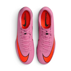 Top-down view of the turf trainers, highlighting the low-cut Vapor silhouette and the chevron texturing across the striking zone.
