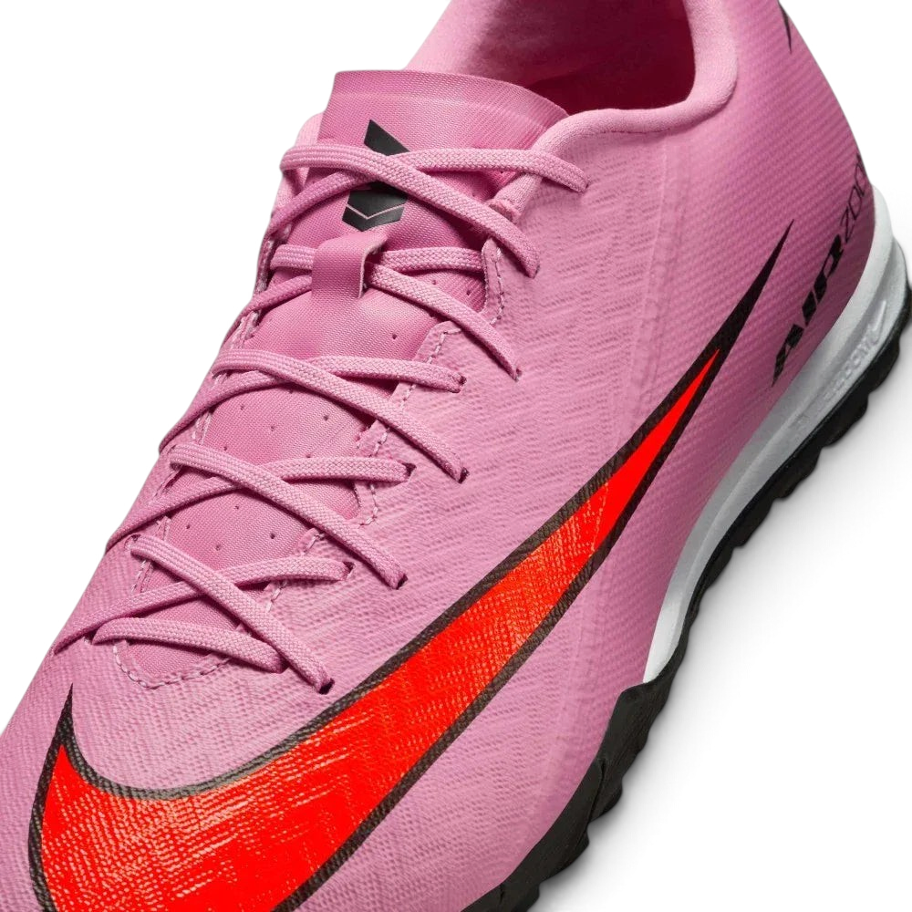 Close-up of the forefoot, focusing on the textured NIKESKIN pattern and the precision lacing system for a secure fit.