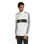 Close-up of the front of the jacket, focusing on the detailed gold embroidery of the Juventus crest and the high-quality zipper.