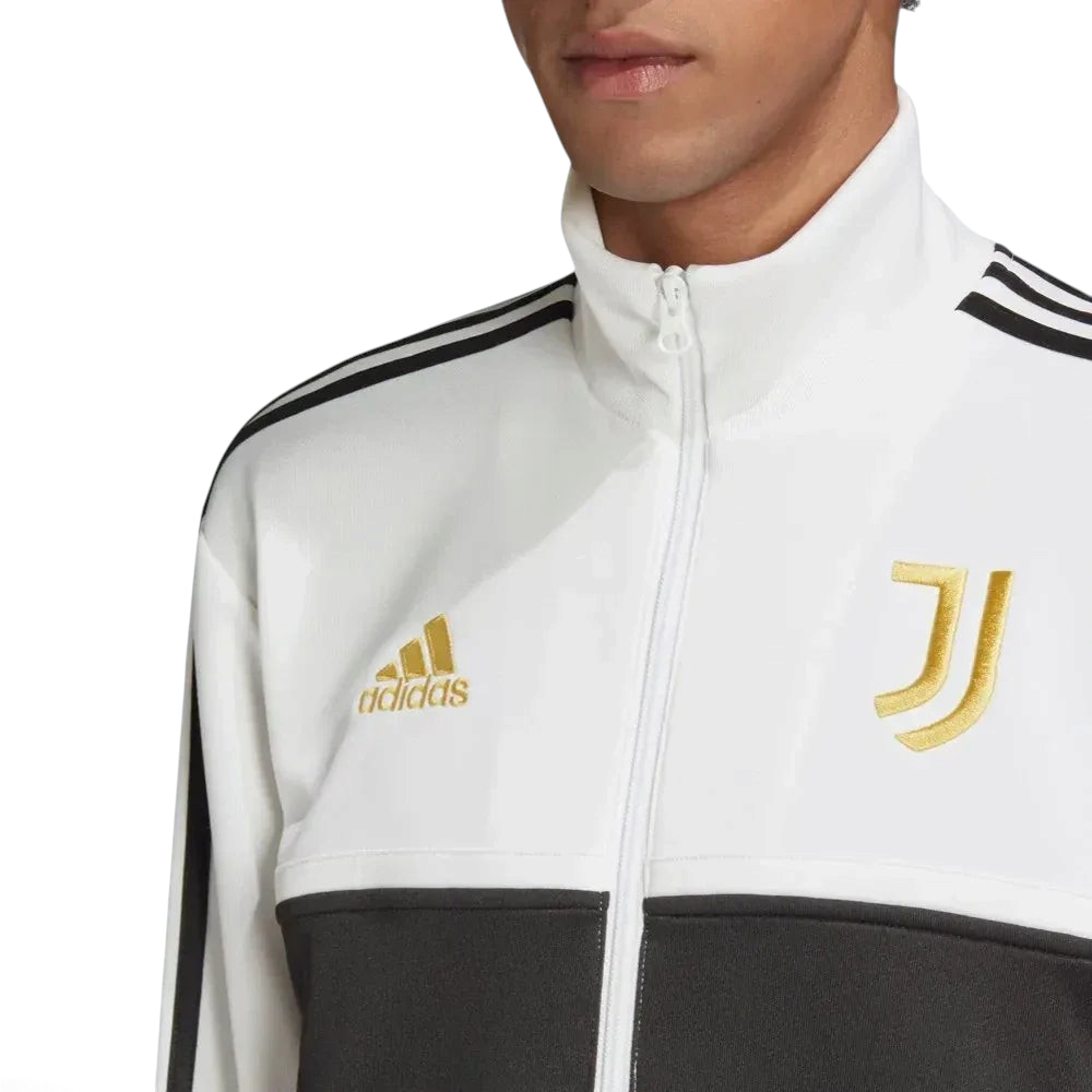Close-up of the front of the jacket, focusing on the detailed gold embroidery of the Juventus crest and the high-quality zipper.