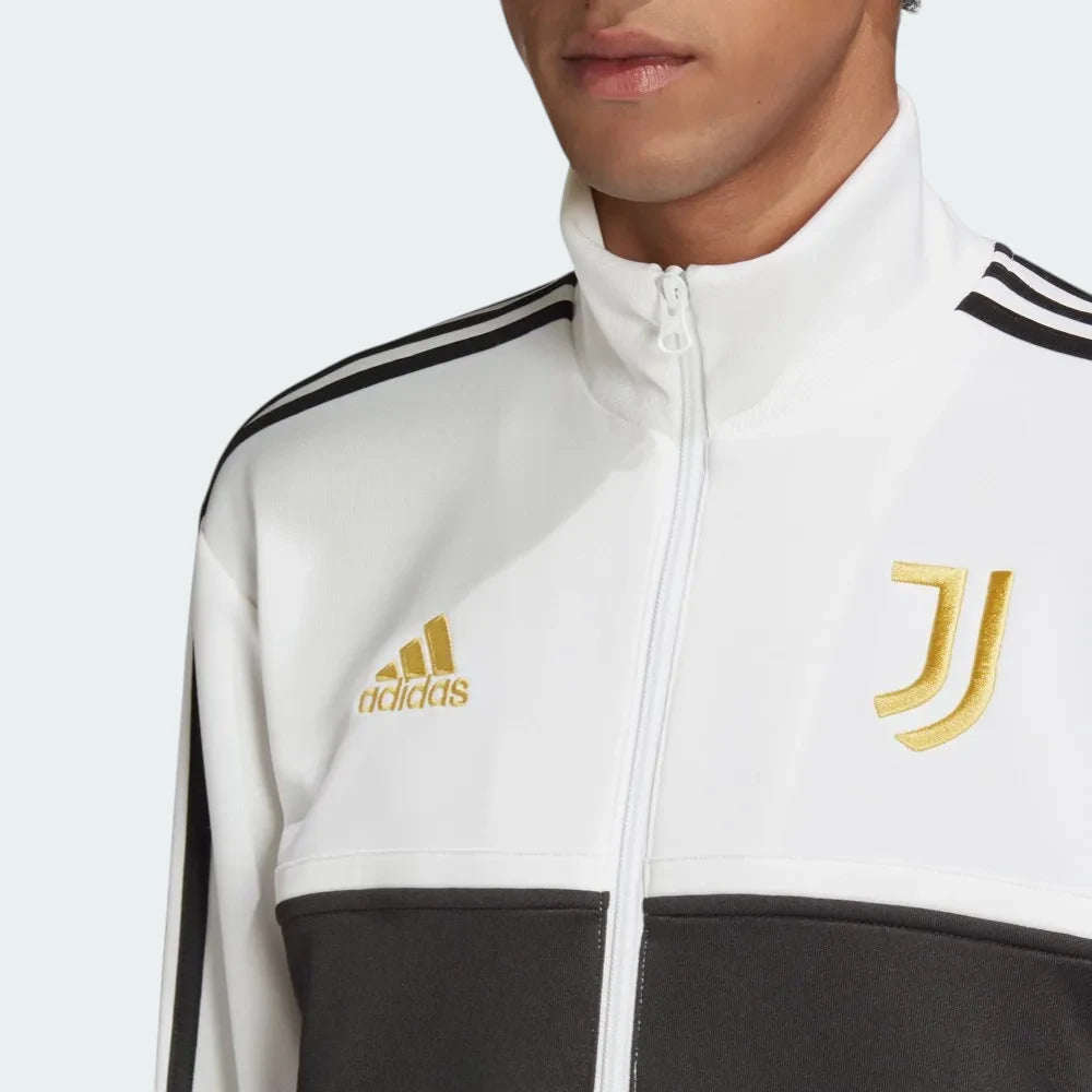 Close-up of the front of the jacket, focusing on the detailed gold embroidery of the Juventus crest and the high-quality zipper.