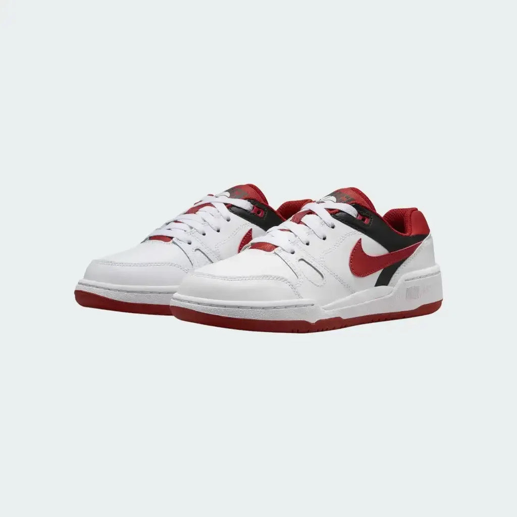 Angled view of two Nike Full Force Lo Juniors' trainers in white, mystic red, and black, side by side, showcasing their retro 80s design.