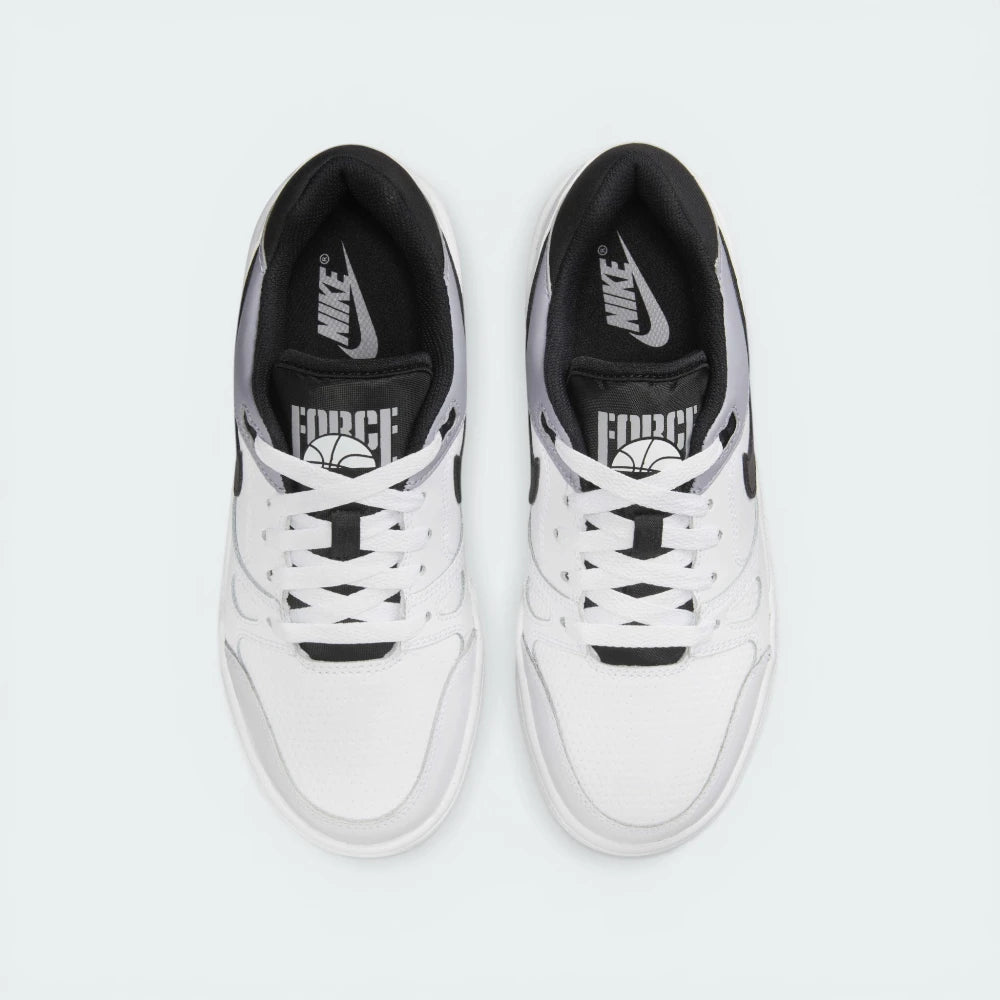 Looking down at the white lacing system, the perforated toe box, and the Force-branded tongue label.