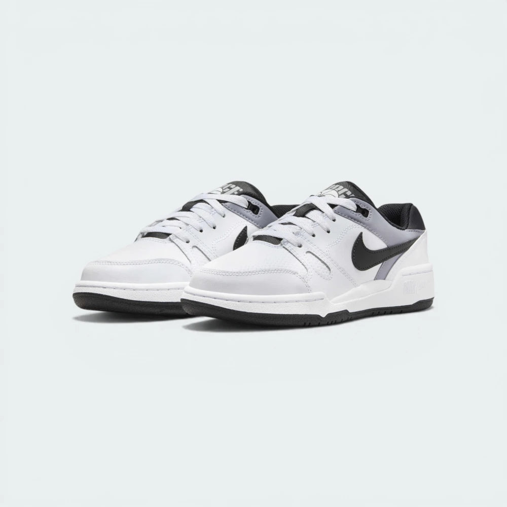 Emphasising the low-profile silhouette and the contrast between the white leather and black accents.