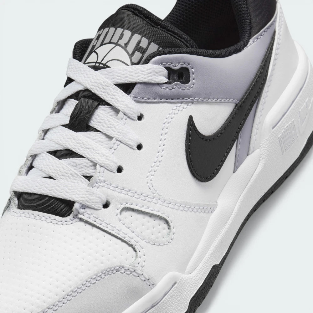 A close-up of the high-quality leather stitching and the classic lace-up closure.