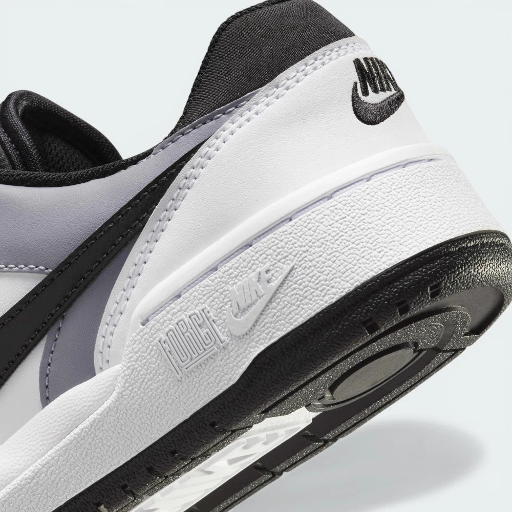 Highlighting the transition between the cushioned foam midsole and the rugged rubber outsole.