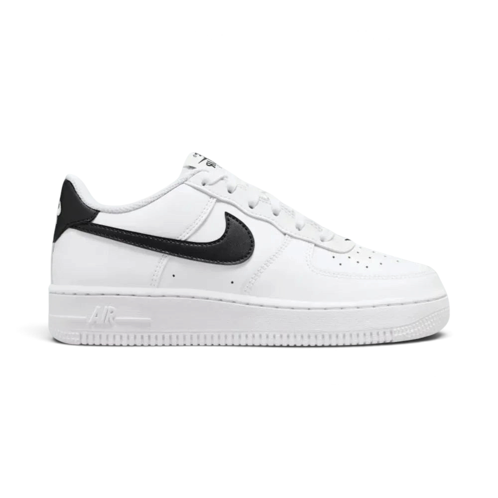 Side profile of the White/Black Nike Air Force 1 Junior, showcasing the bold black Swoosh against the crisp white leather. Main image