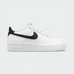 Side profile of the White/Black Nike Air Force 1 Junior, showcasing the bold black Swoosh against the crisp white leather.