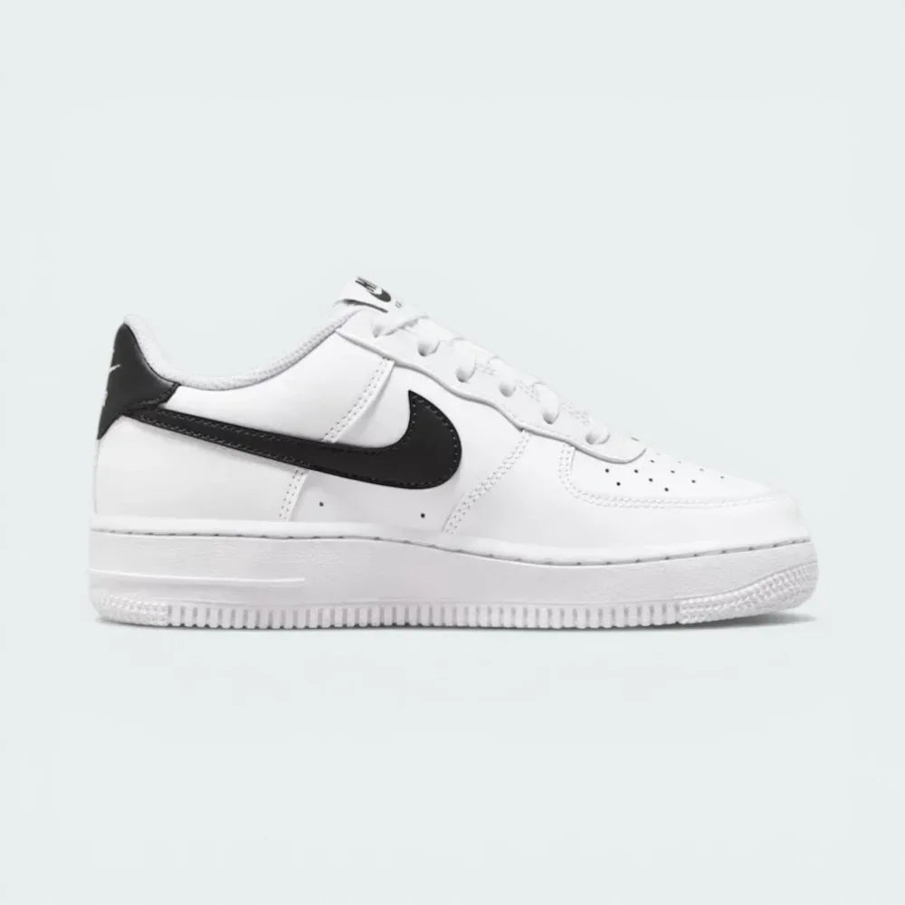 White sneaker with black Nike logo on a light gray background