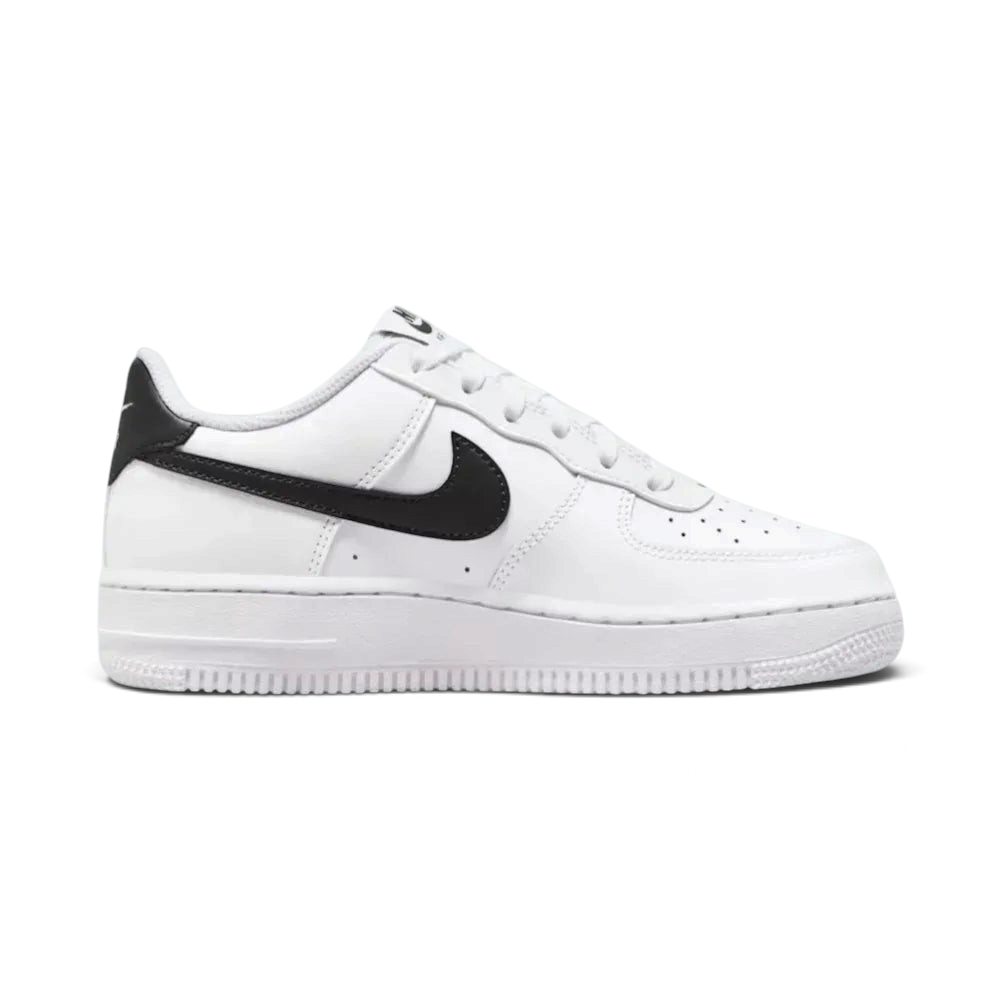 White sneaker with black Nike logo on a light gray background
