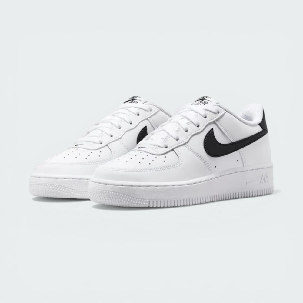 Three-quarter view of the pair, emphasizing the classic low-cut silhouette and the contrast black heel tabs.