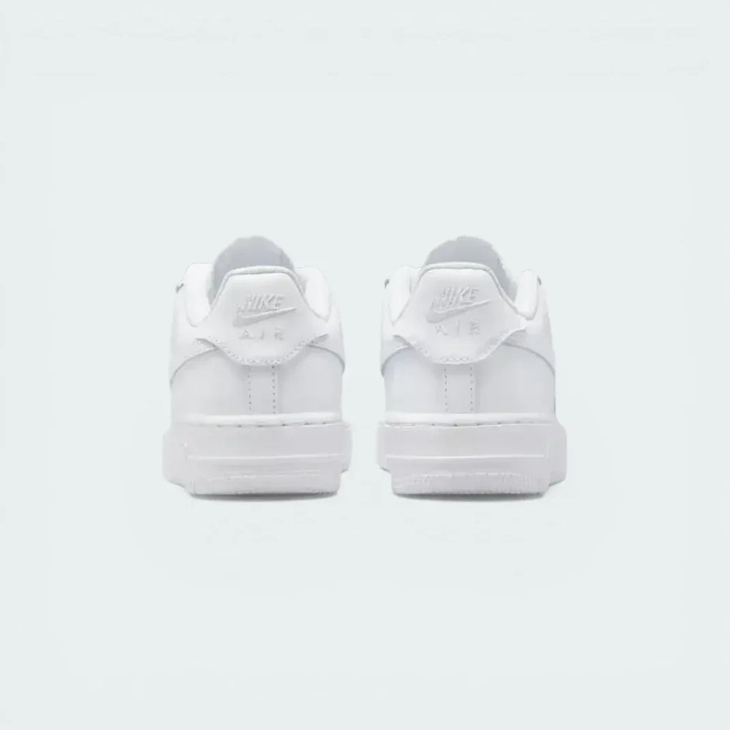 Focuses on the "Nike Air" embroidery and the sturdy, supportive heel construction.
