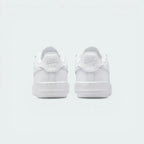 Focuses on the "Nike Air" embroidery and the sturdy, supportive heel construction.