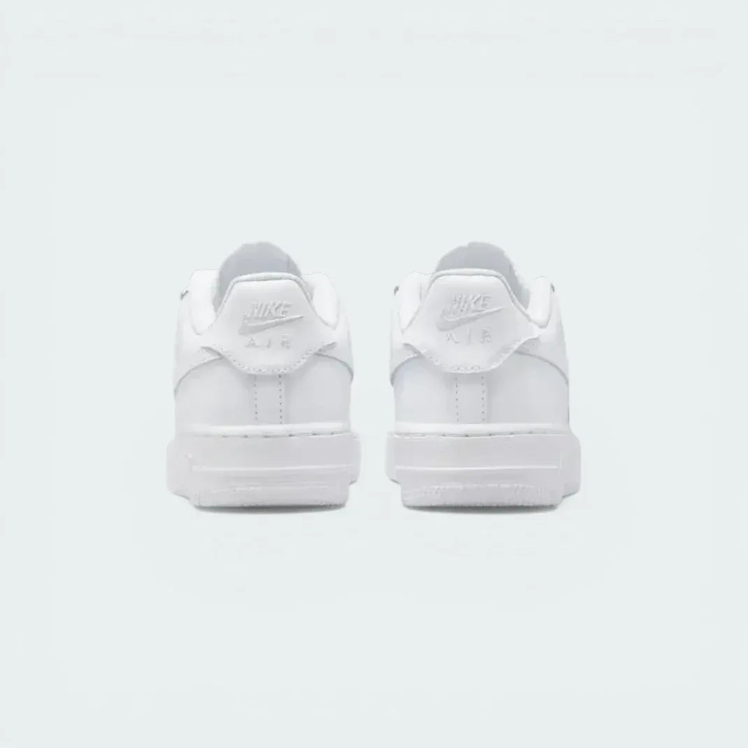 Focuses on the "Nike Air" embroidery and the sturdy, supportive heel construction.