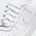 Details the premium leather grain and the silver-tone "AF1" metal deubré.