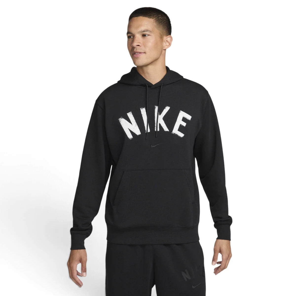 Studio front three-quarter view of a male model wearing the black Nike Swoosh Dri-FIT pullover hoodie, highlighting the distressed white arched "NIKE" chest graphic, matching black drawstrings, and the front kangaroo pocket. Main image