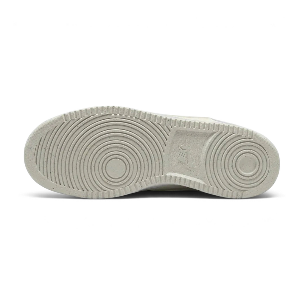 View of the outsole of the Nike Court Vision Lo Next Nature Women's white trainers, showing the durable rubber sole and pivot circle traction pattern.
