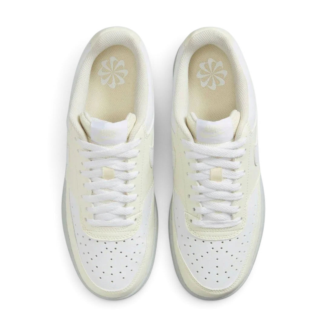 Top-Down view of a pair of Nike Court Vision Lo Next Nature Women's trainers in white, highlighting the lace-up closure and perforated toe box.