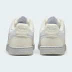 Rear view of the Nike Court Vision Lo Next Nature Women's white trainers, focusing on the heel panel and Nike branding.